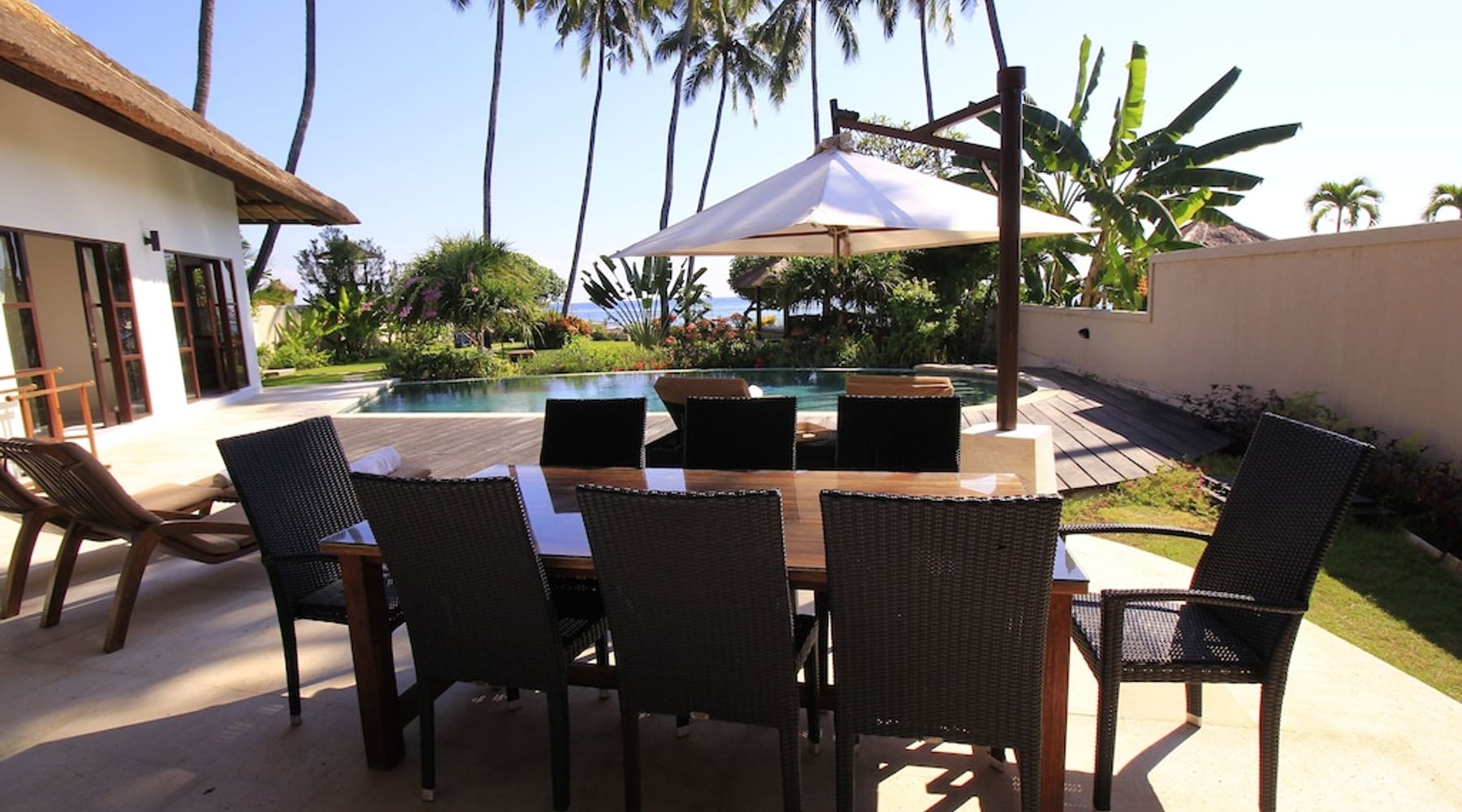 A dining area outside that can accommodate 8 people