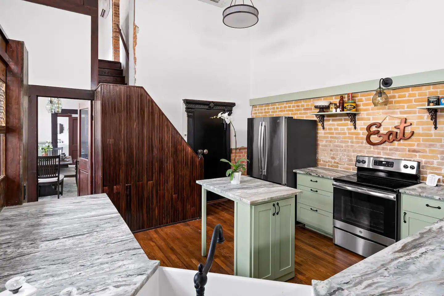 A kitchen in the former teller station, with the teller walls still standing