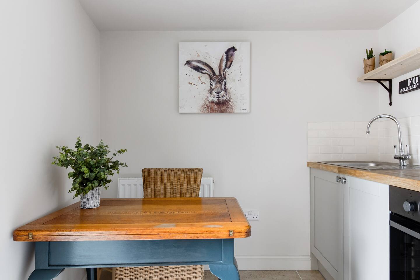 The dining area includes a cute dining table.