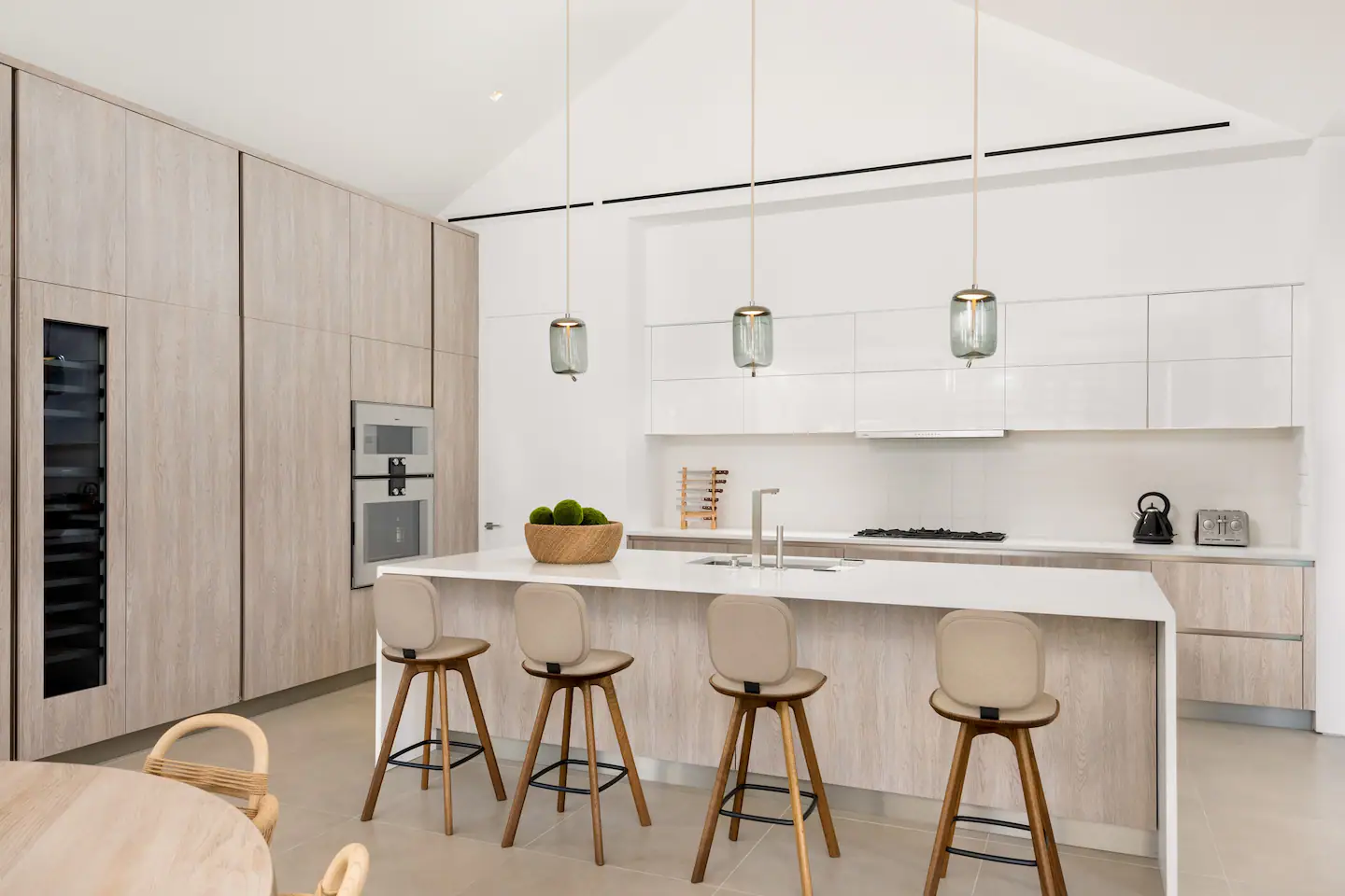 The sleek and modern kitchen features top-of-the-line appliances.