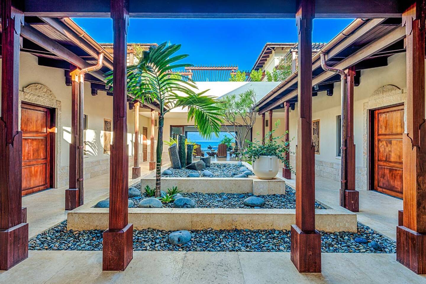A serene Japanese courtyard adorned with a meticulously designed Zen garden.