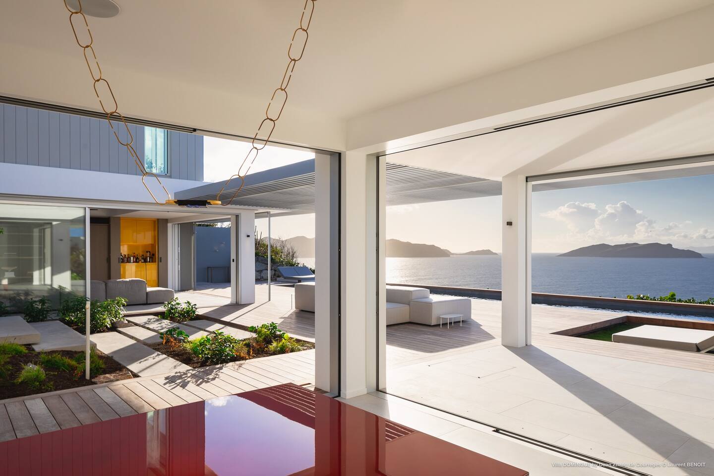Outdoor patio of the villa, furnished with comfortable seating arrangements and offering a perfect spot for relaxation and entertainment.
